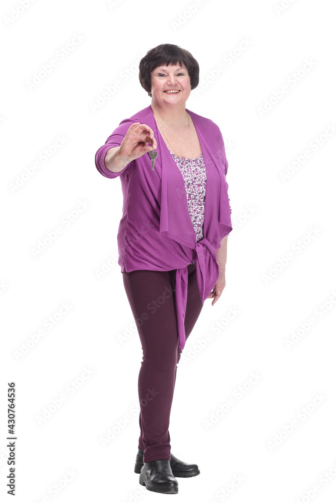 in full growth.happy senior woman with keys in hand. in full growth.happy senior woman with keys in hand.