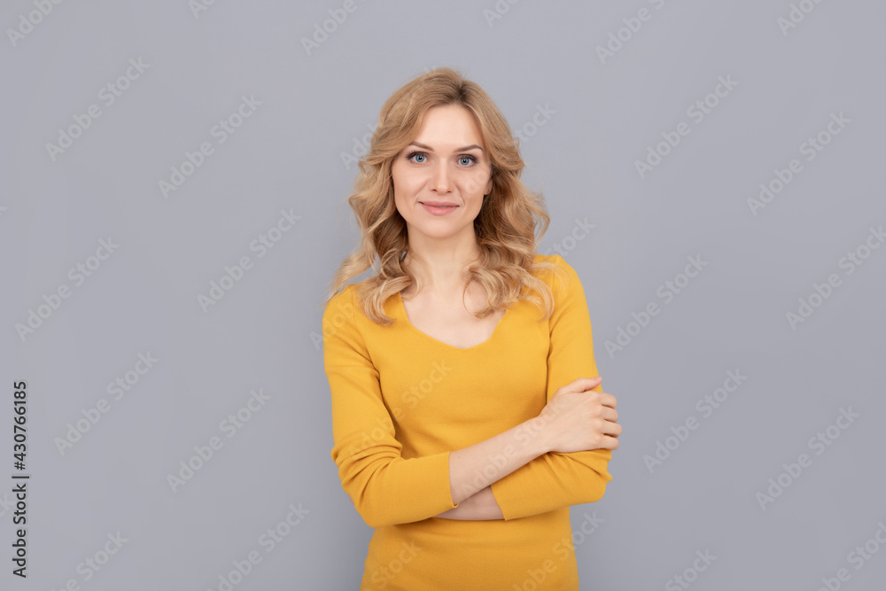 pretty look of young smiling girl. blonde woman crossed hands. blond woman portrait. pretty look of young smiling girl. blonde woman crossed hands. blond woman portrait.