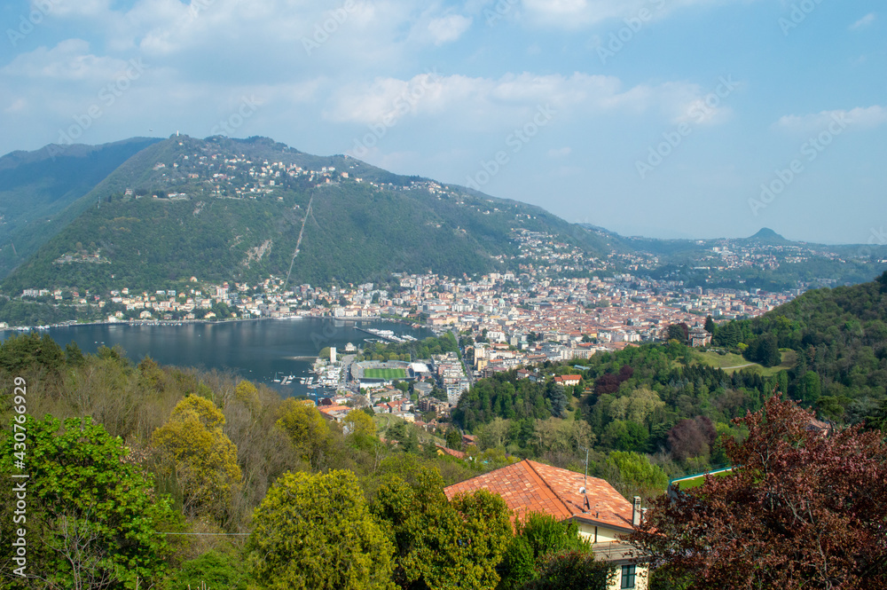 Panoramic aerial view of the city of Como facing the famous Lake Como and the surrounding mountains