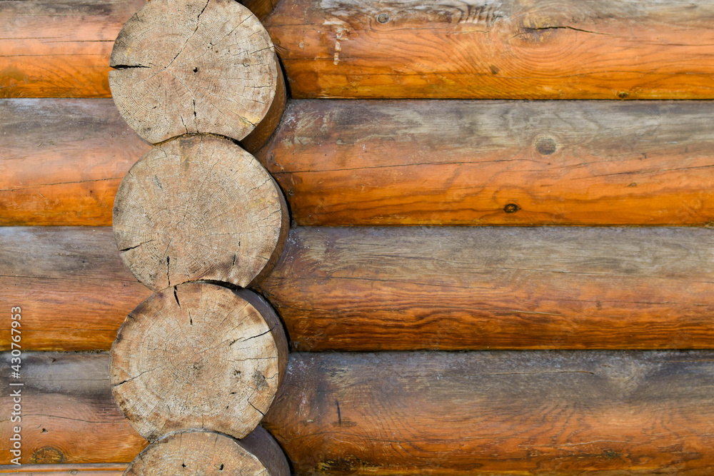 Texture of wall of house made of rounded logs. facade of log house, space for text. Wooden log wall built from smoothly polished logs. Construction of houses from natural materials. Wooden frame Texture of wall of house made of rounded logs. facade of log house, space for text. Wooden log wall built from smoothly polished logs. Construction of houses from natural materials. Wooden frame