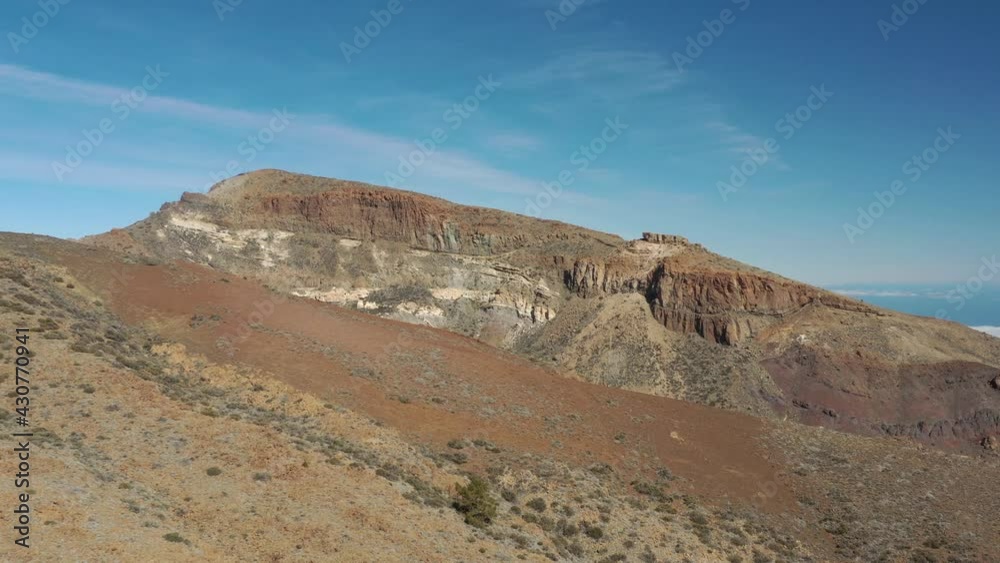 Mountainous rock formations at El Teide national park, Tenerife Canary islands, Spain, Aerial dolly in reveal shot Mountainous rock formations at El Teide national park, Tenerife Canary islands, Spain, Aerial dolly in reveal shot