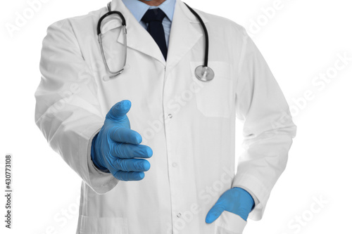 Doctor in gloves offering handshake on white background, closeup