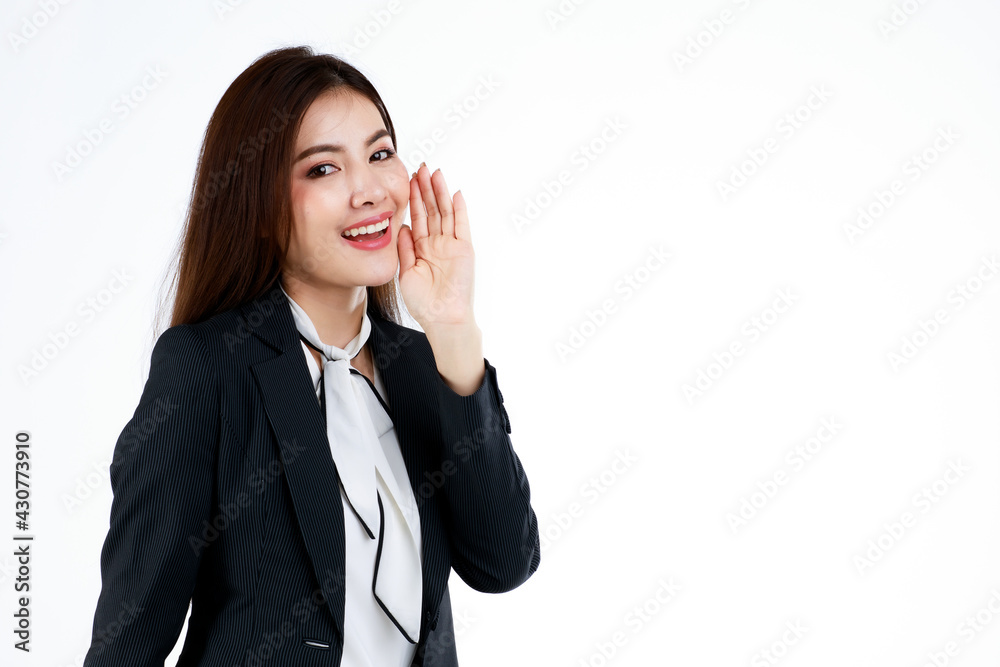 Portrait of young Asian businesswoman model in formal suit uses hands and action in a pose of presenting or demonstrate goods or product in advertising gesture, studio shot on white background Portrait of young Asian businesswoman model in formal suit uses hands and action in a pose of presenting or demonstrate goods or product in advertising gesture, studio shot on white background