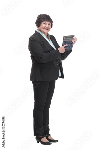 in full growth.smiling business woman with a calculator.