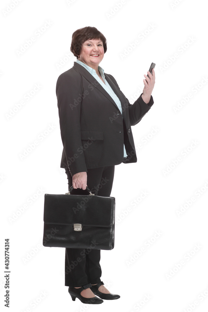 in full growth.Executive business woman with a smartphone. in full growth.Executive business woman with a smartphone.