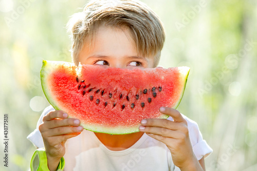 happy child eating watermelon