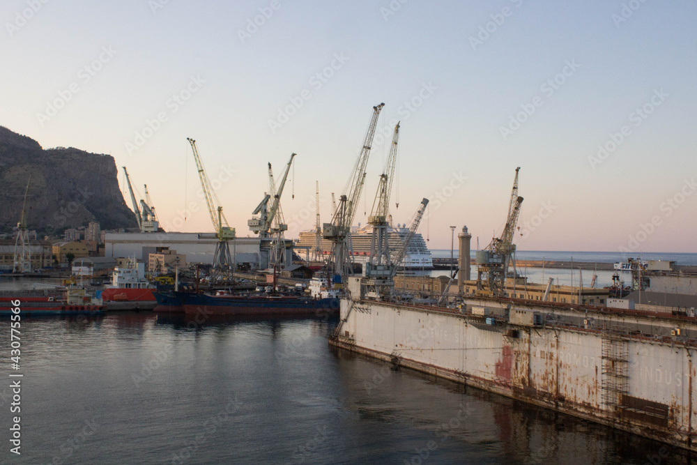 Palermo shipyard in Italy, ships in storage and cranes in the shipyard
