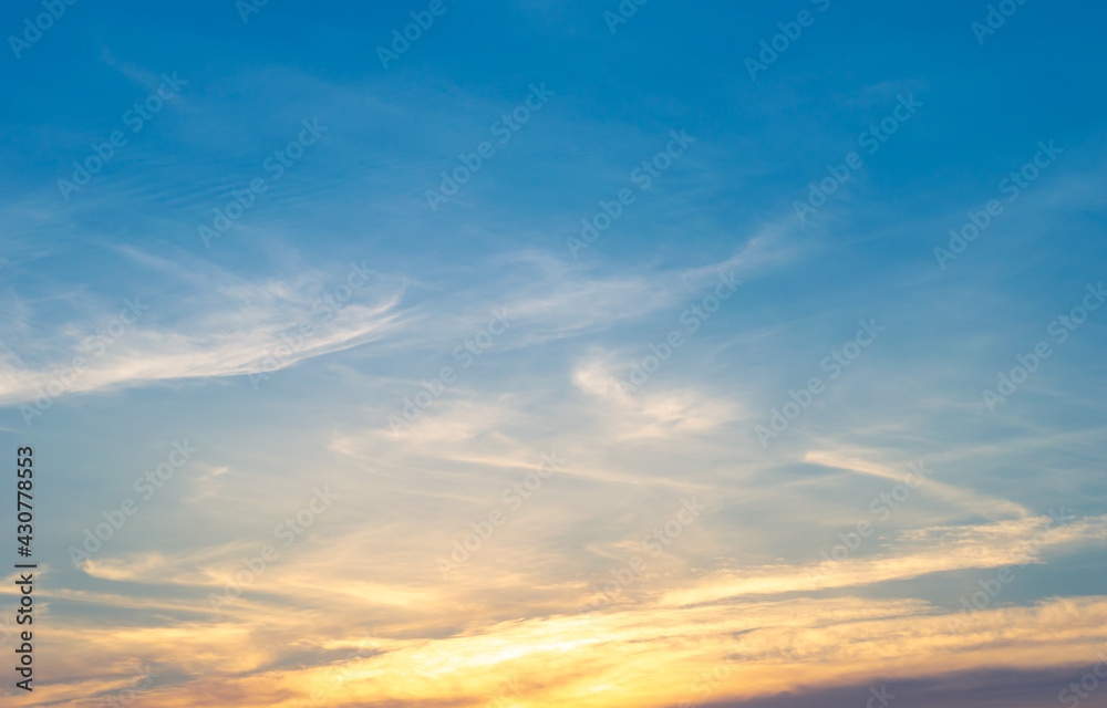 Beautiful Vivid sky painted by the sun leaving bright golden shades.Dense clouds in twilight sky in winter evening.Image of cloud sky on evening time.Evening Vivid sky with clouds.