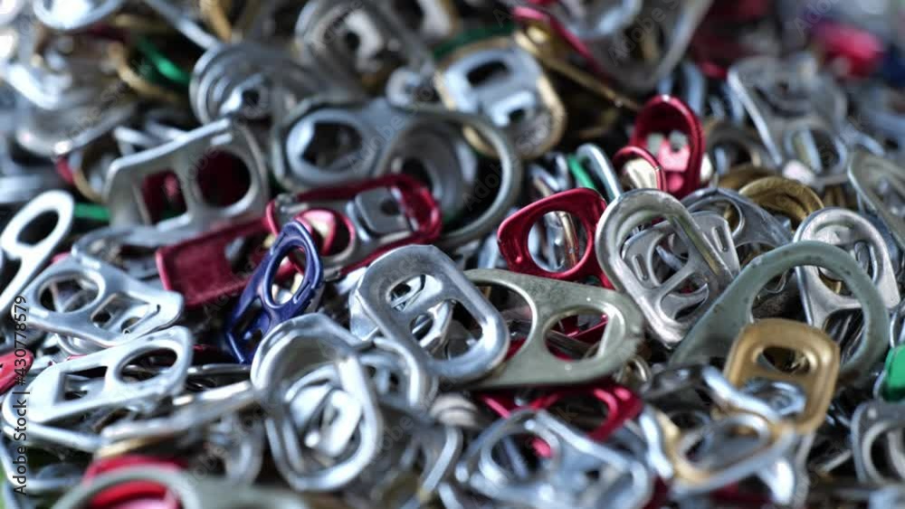 multicolored Metal pull ring of can. Recycling concept