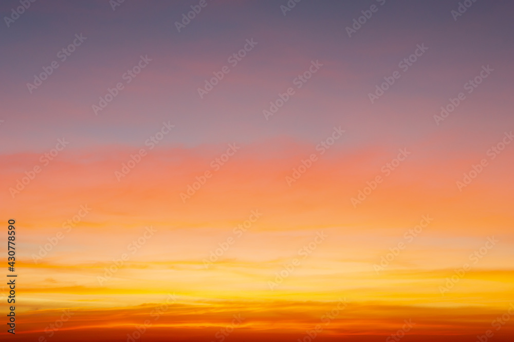 Beautiful sky painted by the sun leaving bright golden shades.Dense clouds in twilight sky in winter evening.Image of cloud sky on evening time.Evening sky scene with golden light from the setting sun Beautiful sky painted by the sun leaving bright golden shades.Dense clouds in twilight sky in winter evening.Image of cloud sky on evening time.Evening sky scene with golden light from the setting sun