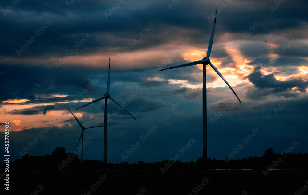 Obraz premium Wind Turbine Tower At Dusk Aerial Drone View - Sustainable Investment