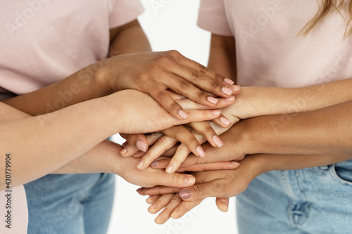 Different ethnicity female hands. Multicultural diversity and friendship.