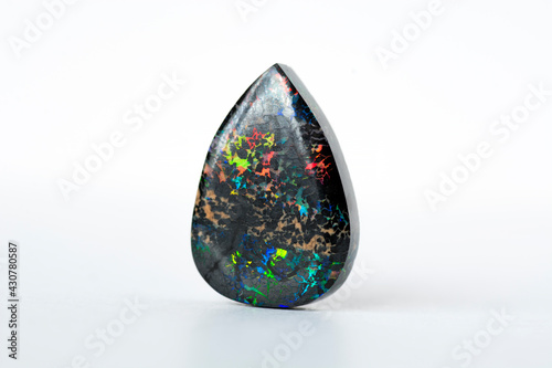 Mined from Queensland fields solid black matrix boulder opal. Red, orange, green, yellow, amber, violet and turquoise color veins play. Ironstone treated, carbonated  to darken and stabilized. 