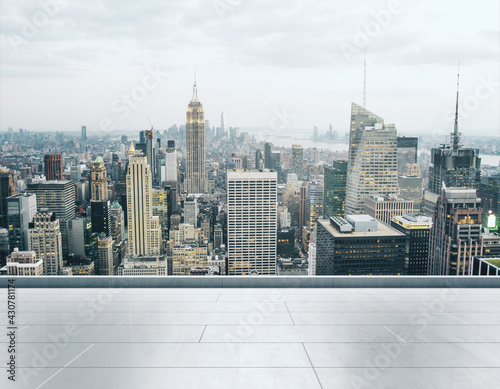 Empty concrete rooftop on the background of a beautiful Manhattan skyline at daytime, mock up