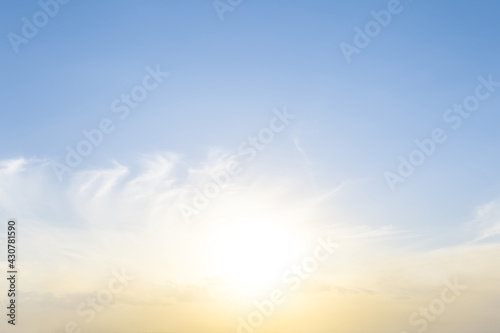 low evening sun on blue cloudy sky, beautiful natural sunset background