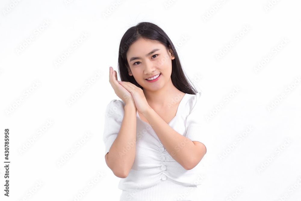 Asian beautiful lady who has long hair smiles and shows her hand near face on white background. Asian beautiful lady who has long hair smiles and shows her hand near face on white background.
