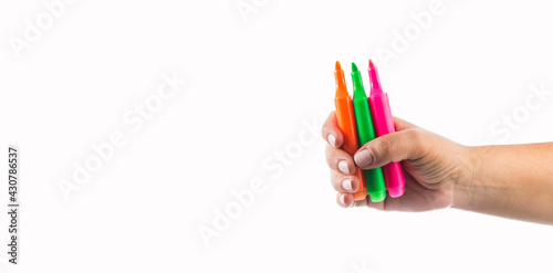 Highlighters in hand isolated white background