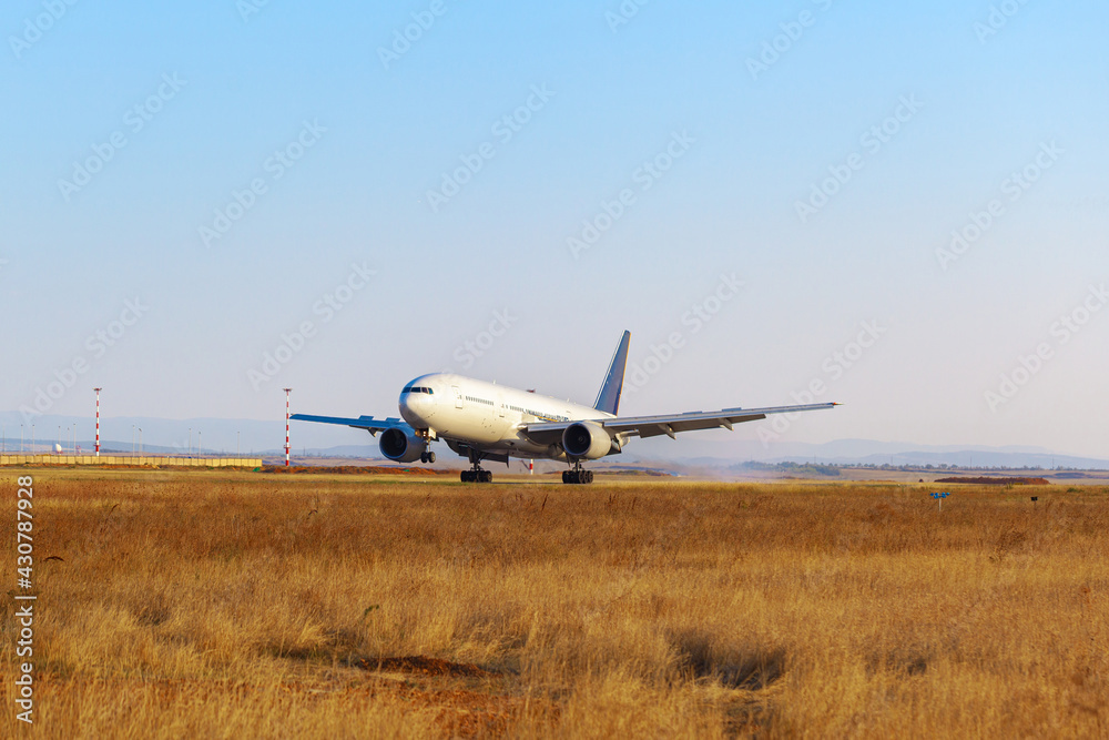 Passenger plane takes off from runway in airport Passenger plane takes off from runway in airport
