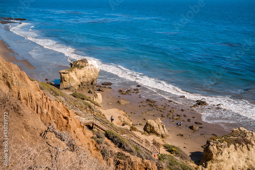 Matador beach and beautiful landscape with rocks and ocean against blue sky, California. Los Angeles, USA - 15 Apr 2021 photo