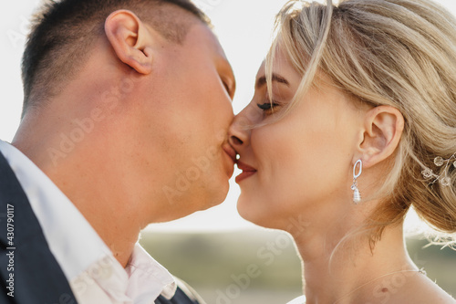 Portrait of a bride and groom in a sunset light