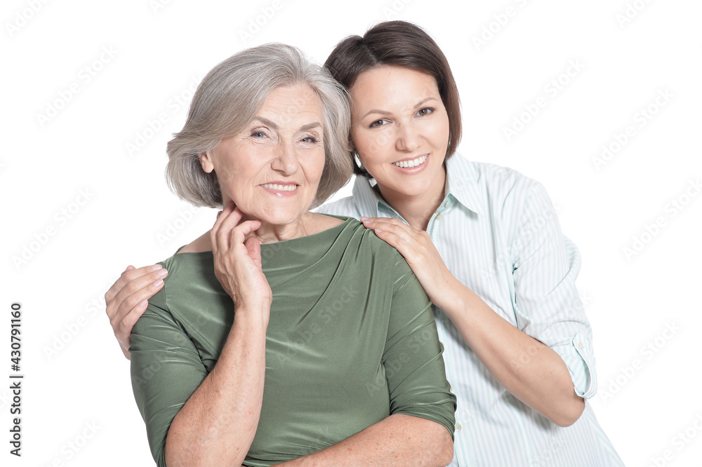 close up portrait of mother and her adult daughter hugging isolated on white close up portrait of mother and her adult daughter hugging isolated on white
