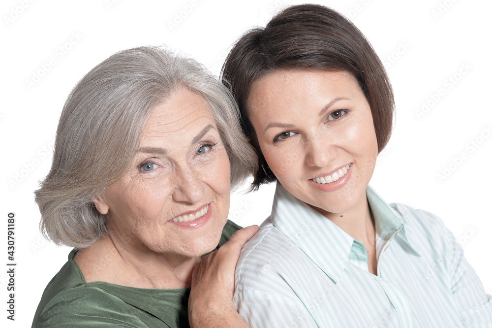 close up portrait of mother and her adult daughter hugging isolated on white close up portrait of mother and her adult daughter hugging isolated on white