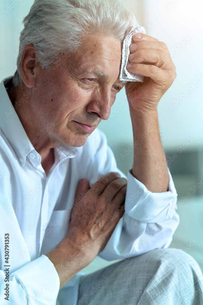 Portrait of sad sick senior man with headache Portrait of sad sick senior man with headache