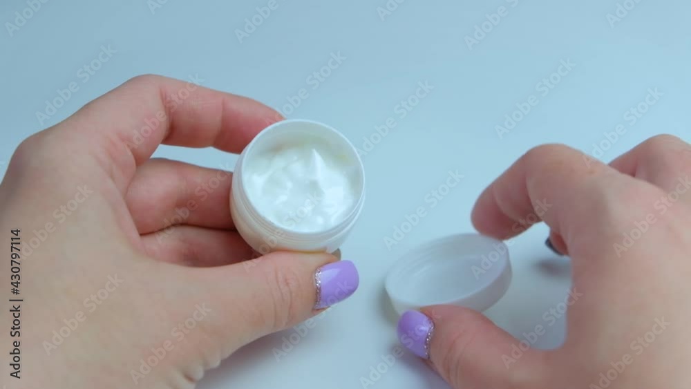 Woman and her morning skincare routine, female hand applying moisturizing cream or body lotion for healthy skin, organic cosmetic product and luxury beauty brand, stock footage Woman and her morning skincare routine, female hand applying moisturizing cream or body lotion for healthy skin, organic cosmetic product and luxury beauty brand, stock footage
