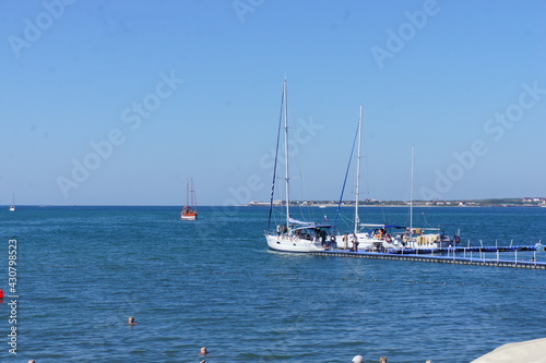 Yachts at the pier of the embankment of the resort city of Gelendzhik in the North Caucasus in the Krasnodar Territory