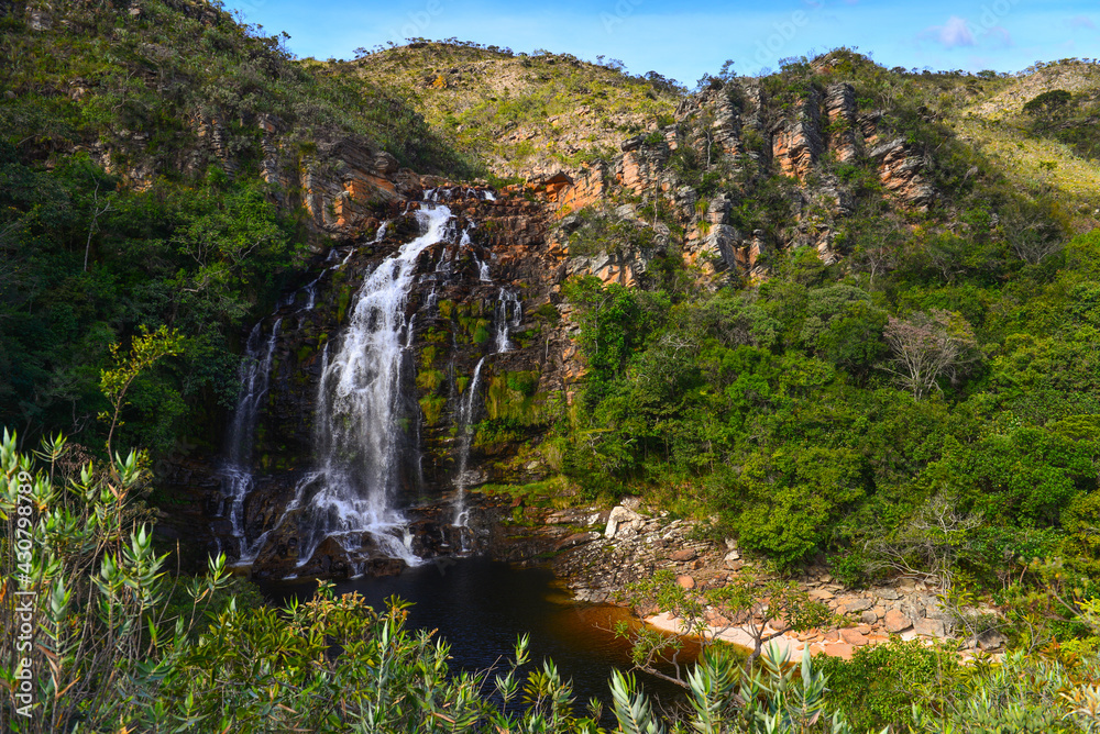 The idyllic Cachoeira da Serra Morena waterfall on the rocky landscape of Serra do Cipó range, Minas Gerais, Brazil The idyllic Cachoeira da Serra Morena waterfall on the rocky landscape of Serra do Cipó range, Minas Gerais, Brazil