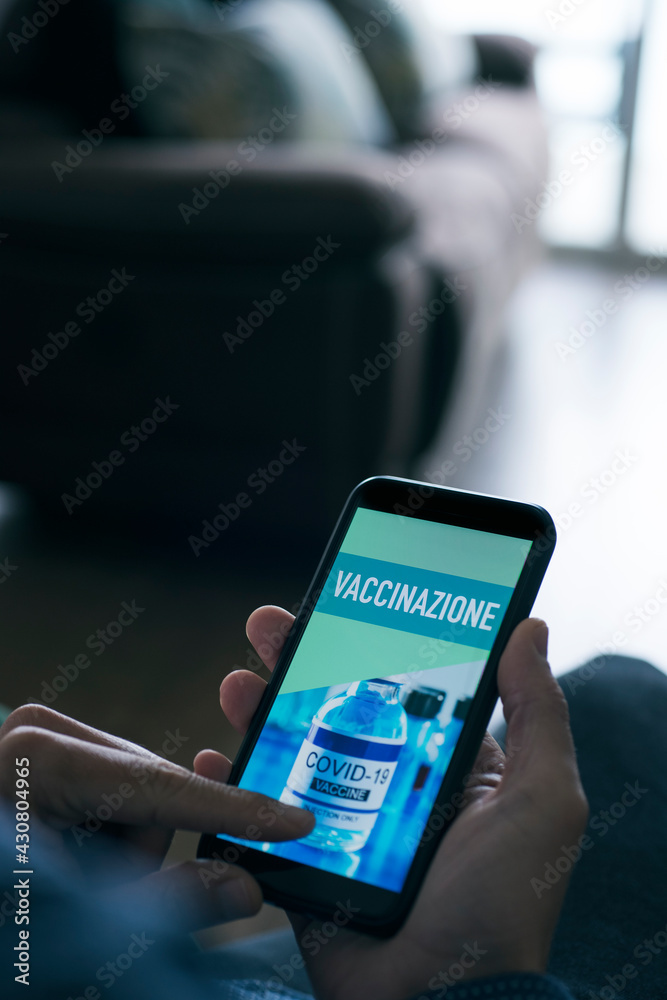 text vaccination in italian in his smartphone text vaccination in italian in his smartphone