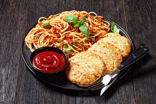 cod fish patties with pasta, top view