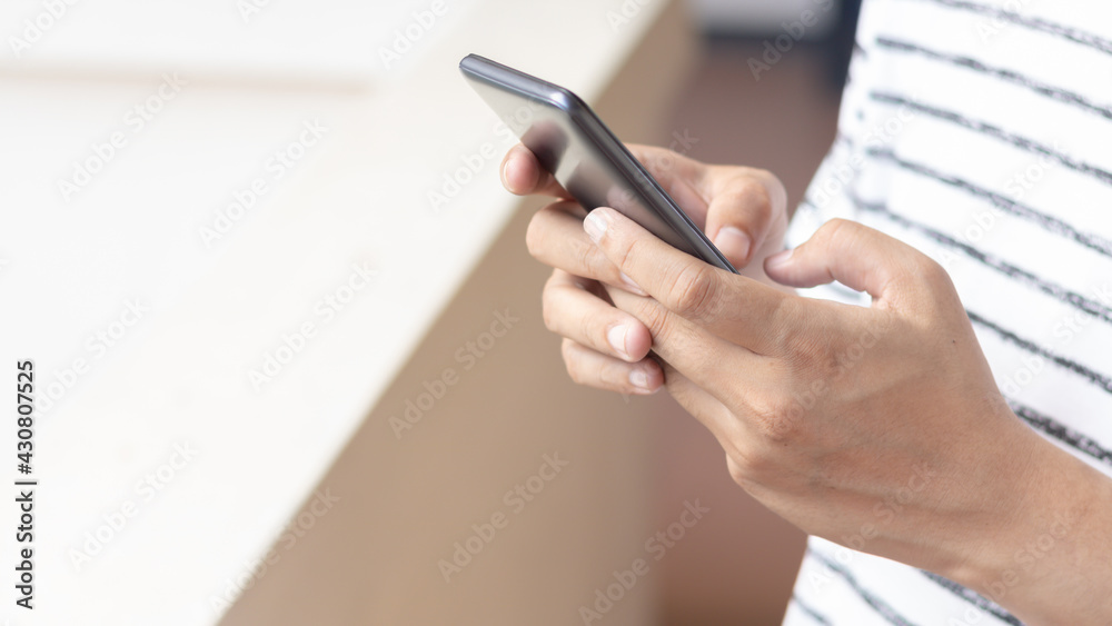 Hand holding and using smartphone. Hand holding and using smartphone.