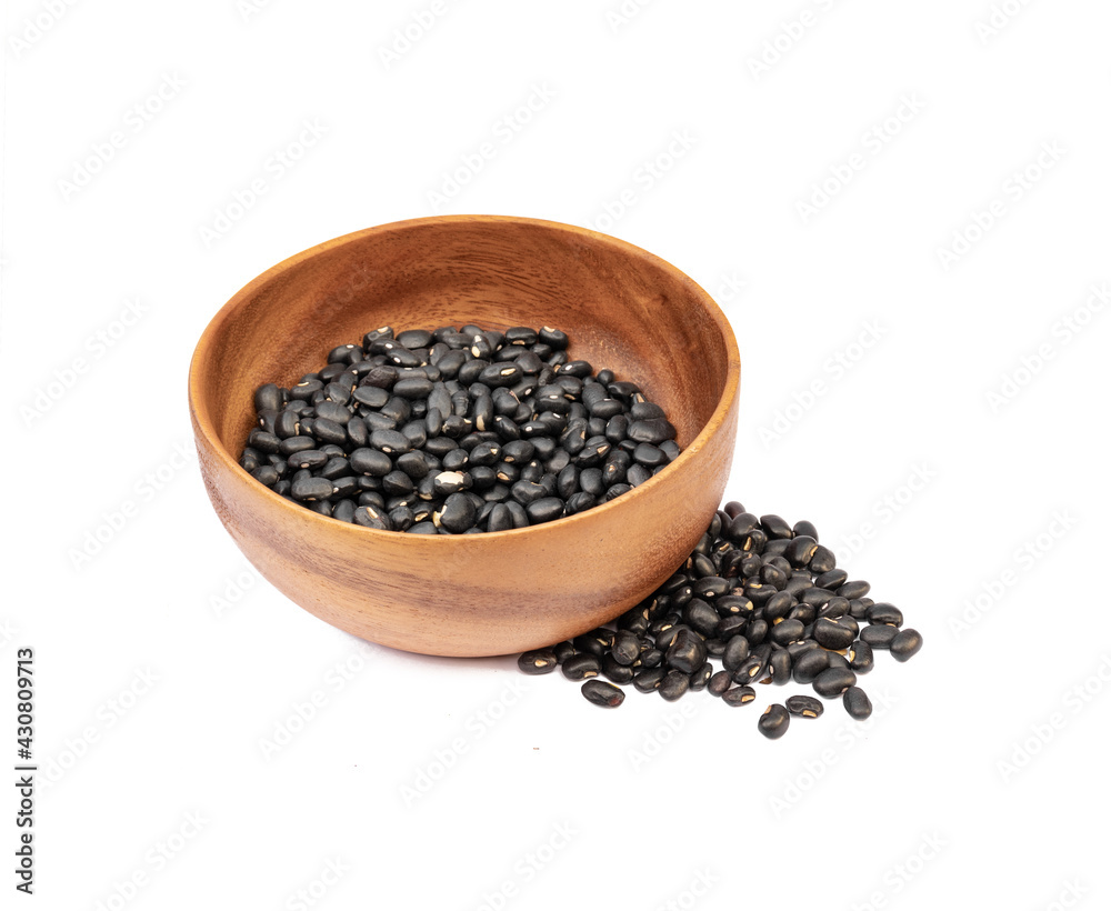Black beans in wooden bowl on white background Black beans in wooden bowl on white background