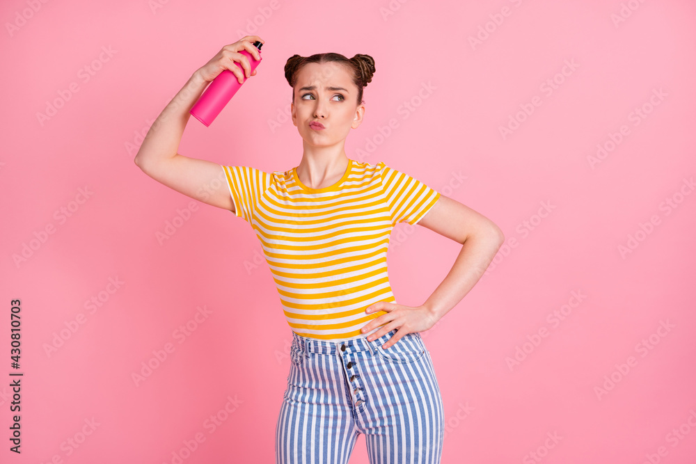 Portrait of young person arm hold hairdresser look empty space sullen lips isolated on pink color background Portrait of young person arm hold hairdresser look empty space sullen lips isolated on pink color background
