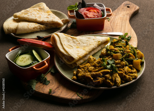Tableau sur toile Indian-surinamese spicy food lunch and dinner, roti chicken curry