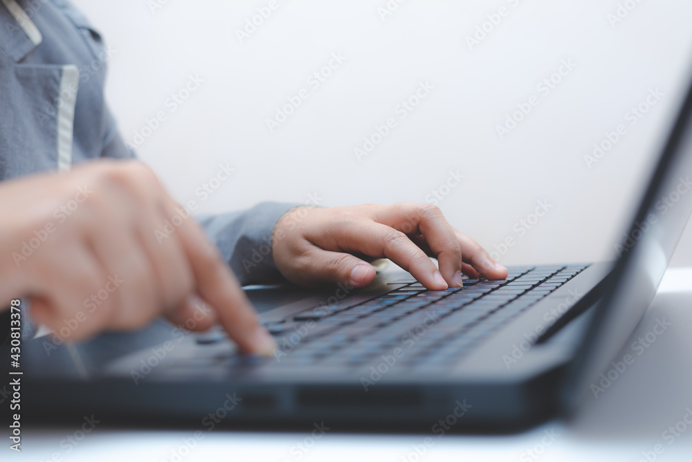 close-up of business woman hand typing and using laptop keyboard for searching with technology networking on working and job on desk at work place or work at home. close-up of business woman hand typing and using laptop keyboard for searching with technology networking on working and job on desk at work place or work at home.