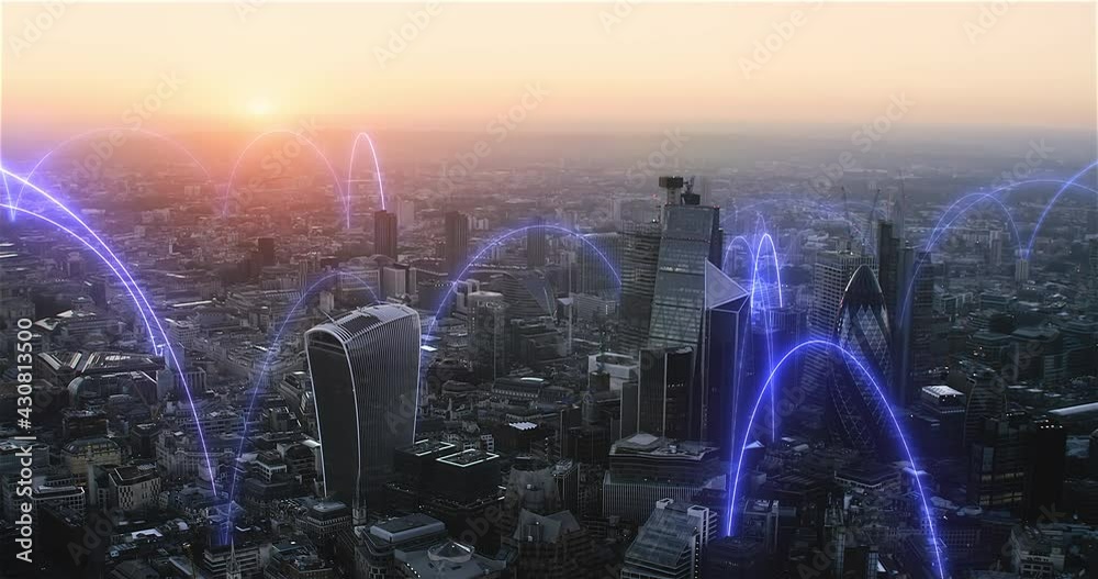 Smart city and communication network concept. Holographic arches over a futuristic aerial view of London, England. Augmented reality. Shot in 8K.