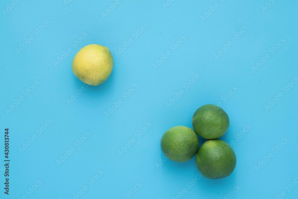 Natural fresh lime isolated on blue background Natural fresh lime isolated on blue background