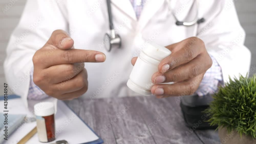 doctor hand holding pill container with copy space doctor hand holding pill container with copy space