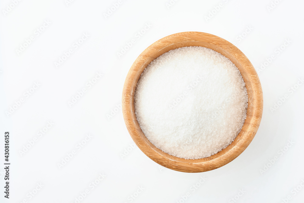 Sugar cube in bamboo bowl isolated on white background. Top view. Sugar cube in bamboo bowl isolated on white background. Top view.