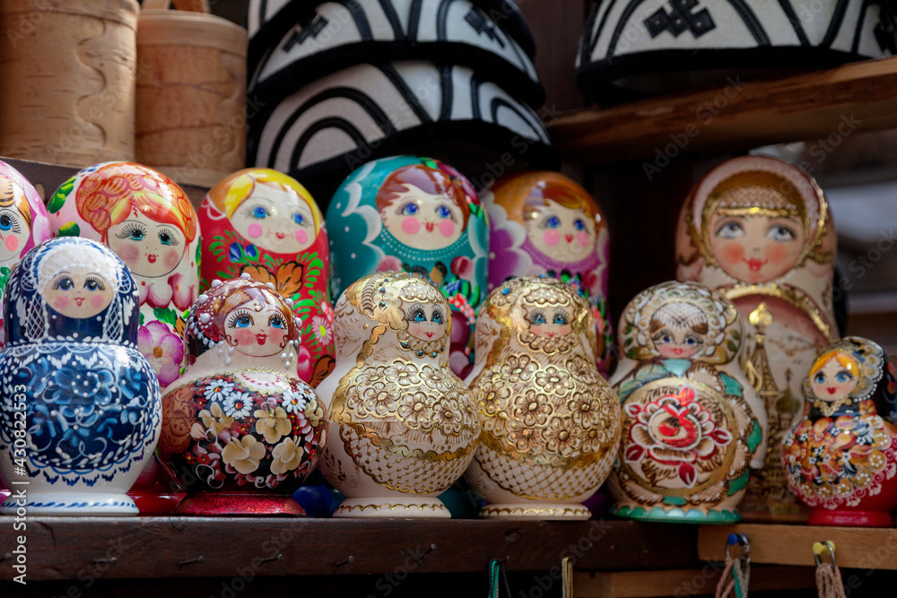 Group of Matryoshka dolls on a market stall.