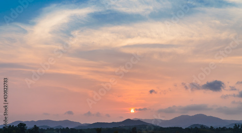 sunset sky over the mountains in evening 