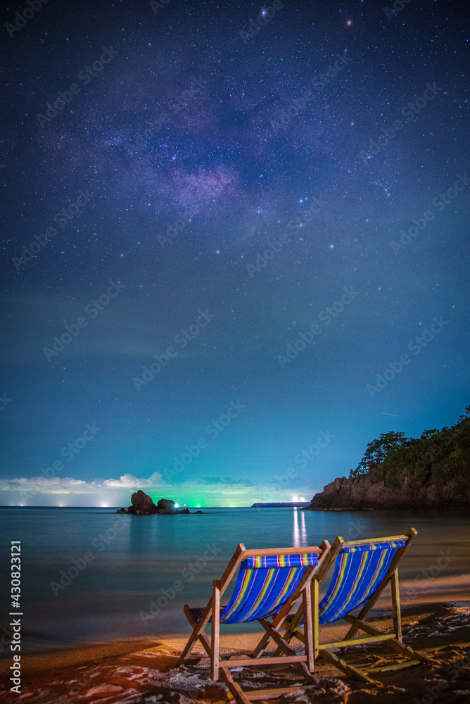 Landscape with Milky way galaxy. Night sky with stars and milky way over sea and mountain.