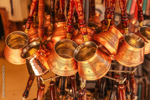 Turkish coffee maker in the sovereign shop. Many Metal Turkish Turk Coffee Makers For Turkish Coffee photo