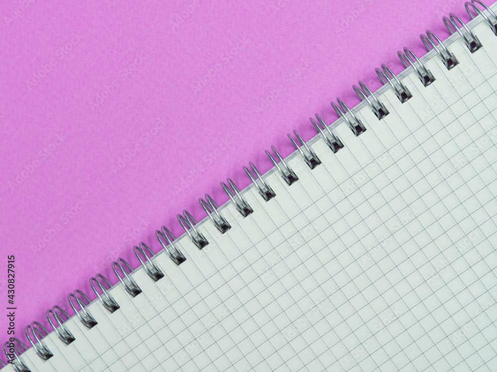 Top view above of workplace with a white notepad on the purple background. Copy space for your text, Flat lay. Office work and office conception. Top view above of workplace with a white notepad on the purple background. Copy space for your text, Flat lay. Office work and office conception.