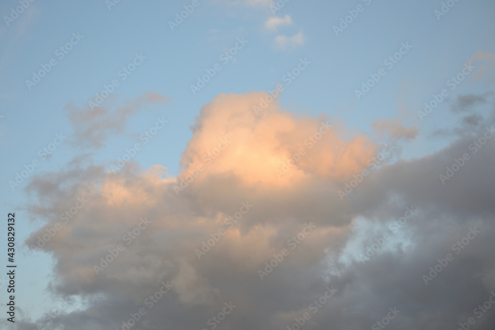 Fototapeta premium Background of a sky of grey soft color with white and pink clouds.