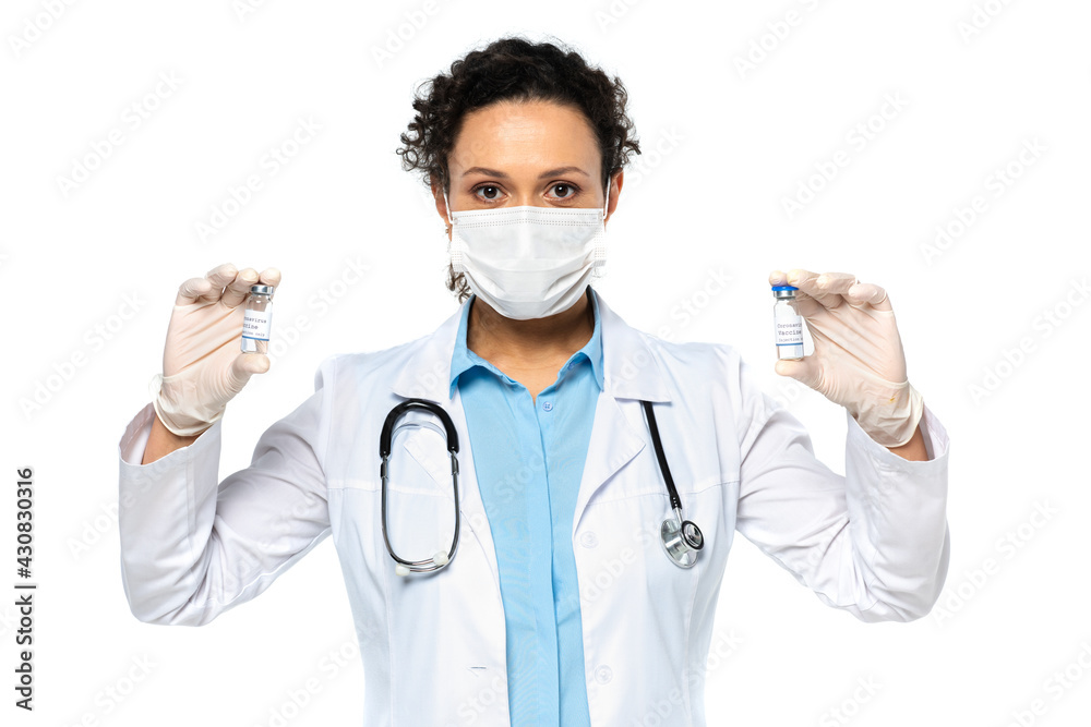 African american doctor in medical mask holding vaccine isolated on white African american doctor in medical mask holding vaccine isolated on white