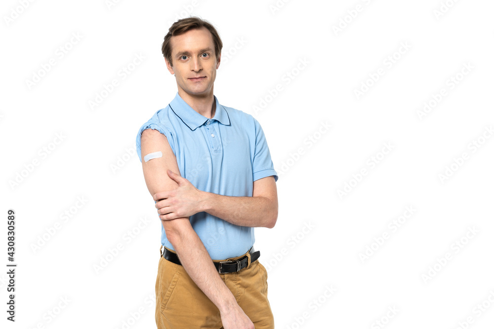 Man with medical path on arm looking at camera isolated on white Man with medical path on arm looking at camera isolated on white