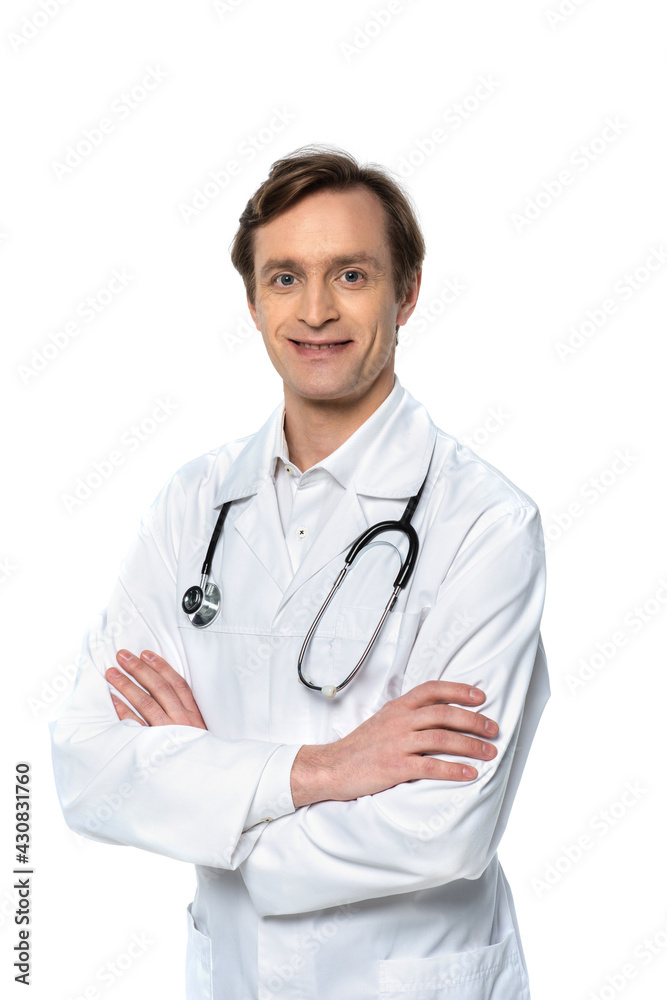 Cheerful doctor standing with crossed arms isolated on white Cheerful doctor standing with crossed arms isolated on white